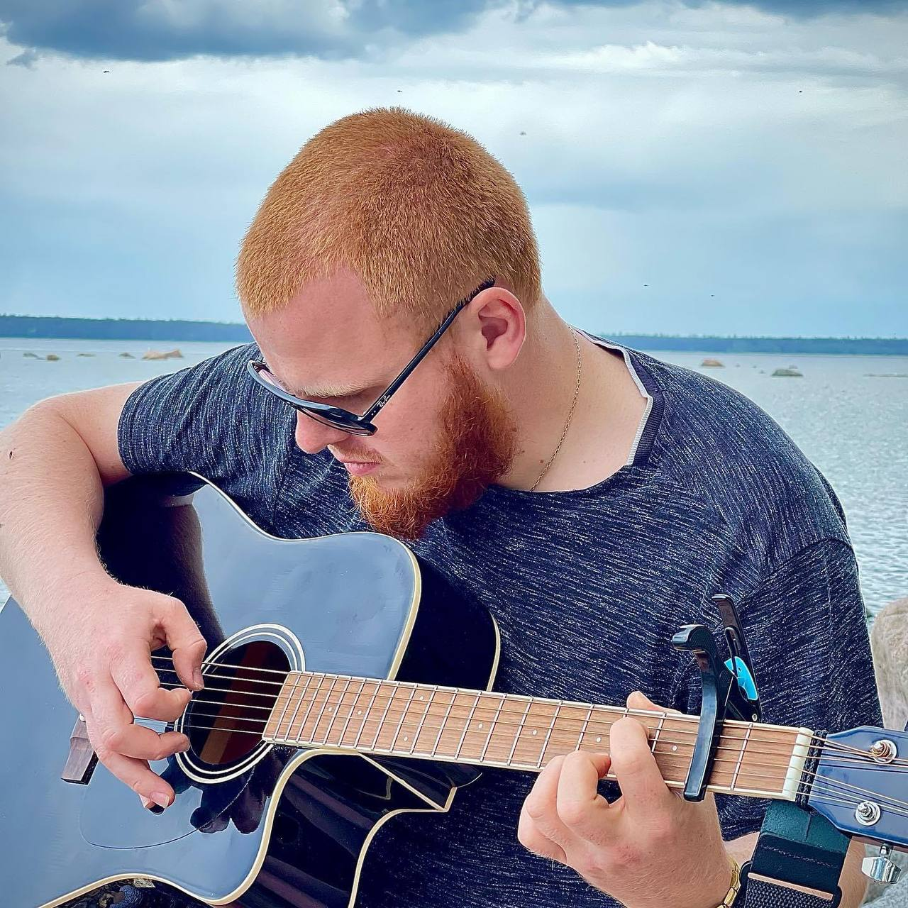 A guitar by the water